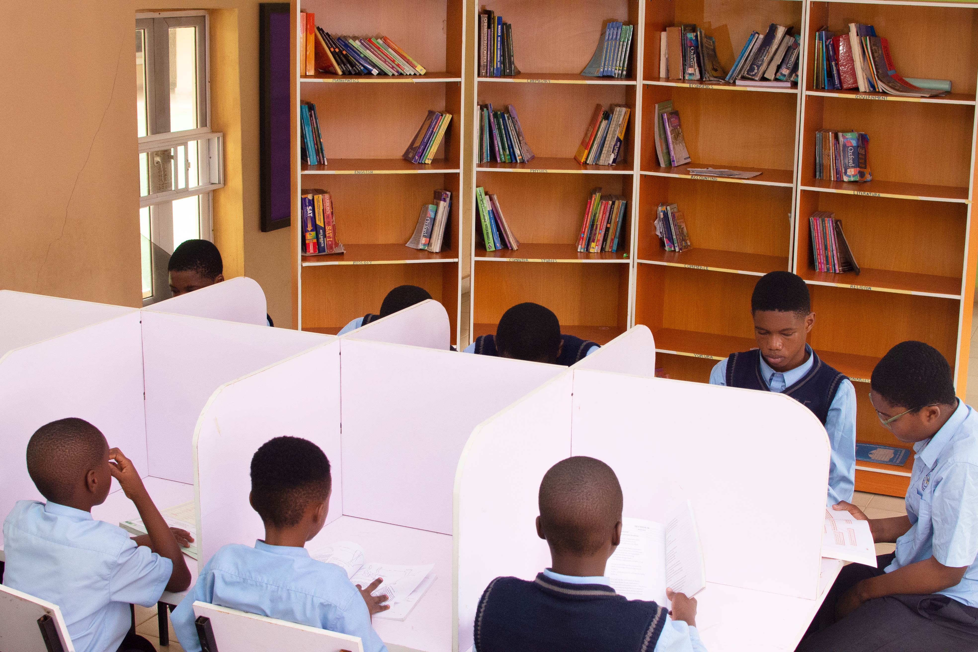 Students reading at study carrels in the College library